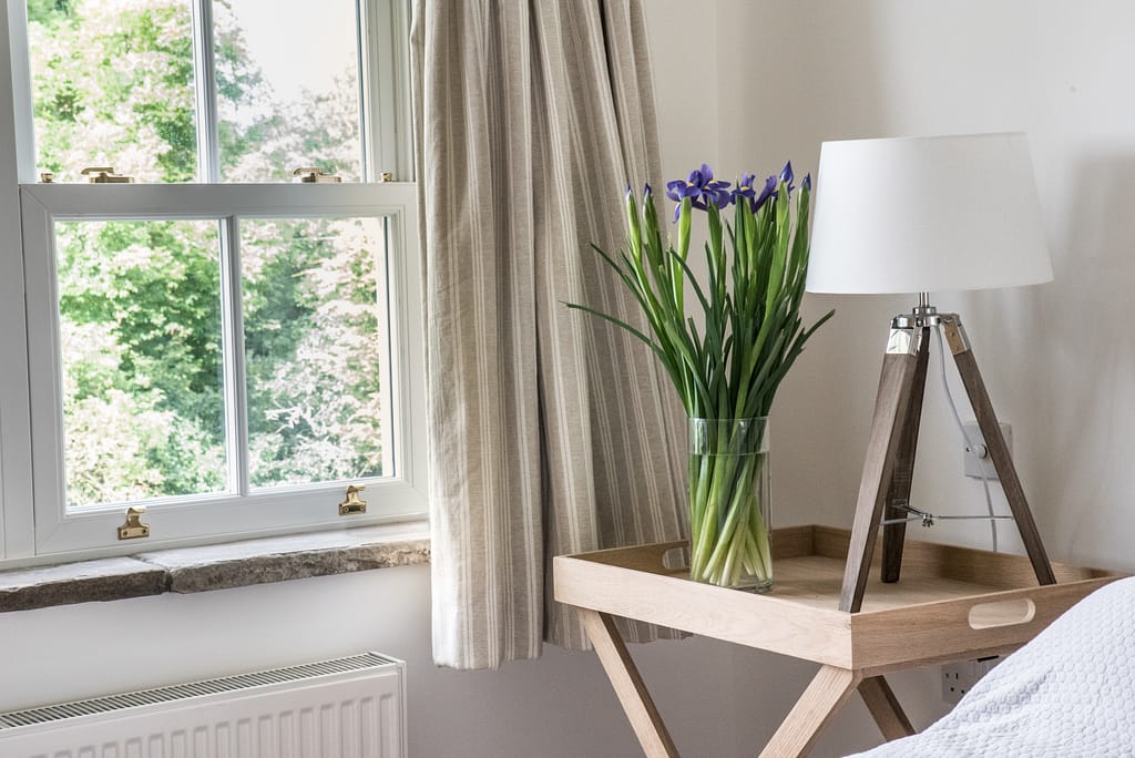 flowers on table with lamp