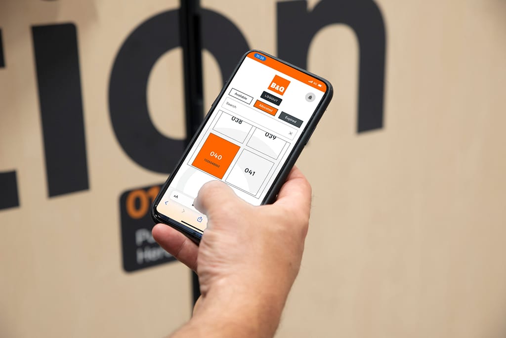 Young woman in b&q using a smart locker app